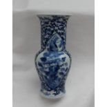 A garniture of three Chinese porcelain vases, the central vase with a flared rim and baluster body,