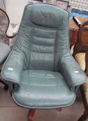 A green leather swivel chair