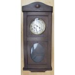 A 20th century oak wall clock