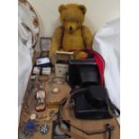 A mohair teddy bear together with two cameras, watches,