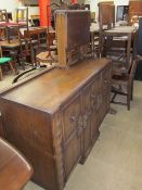 A 20th century oak dining room suite comprising an extending dining table, six assorted chairs,
