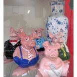 A set of five Wade NatWest pig piggy banks together with a continental porcelain vase