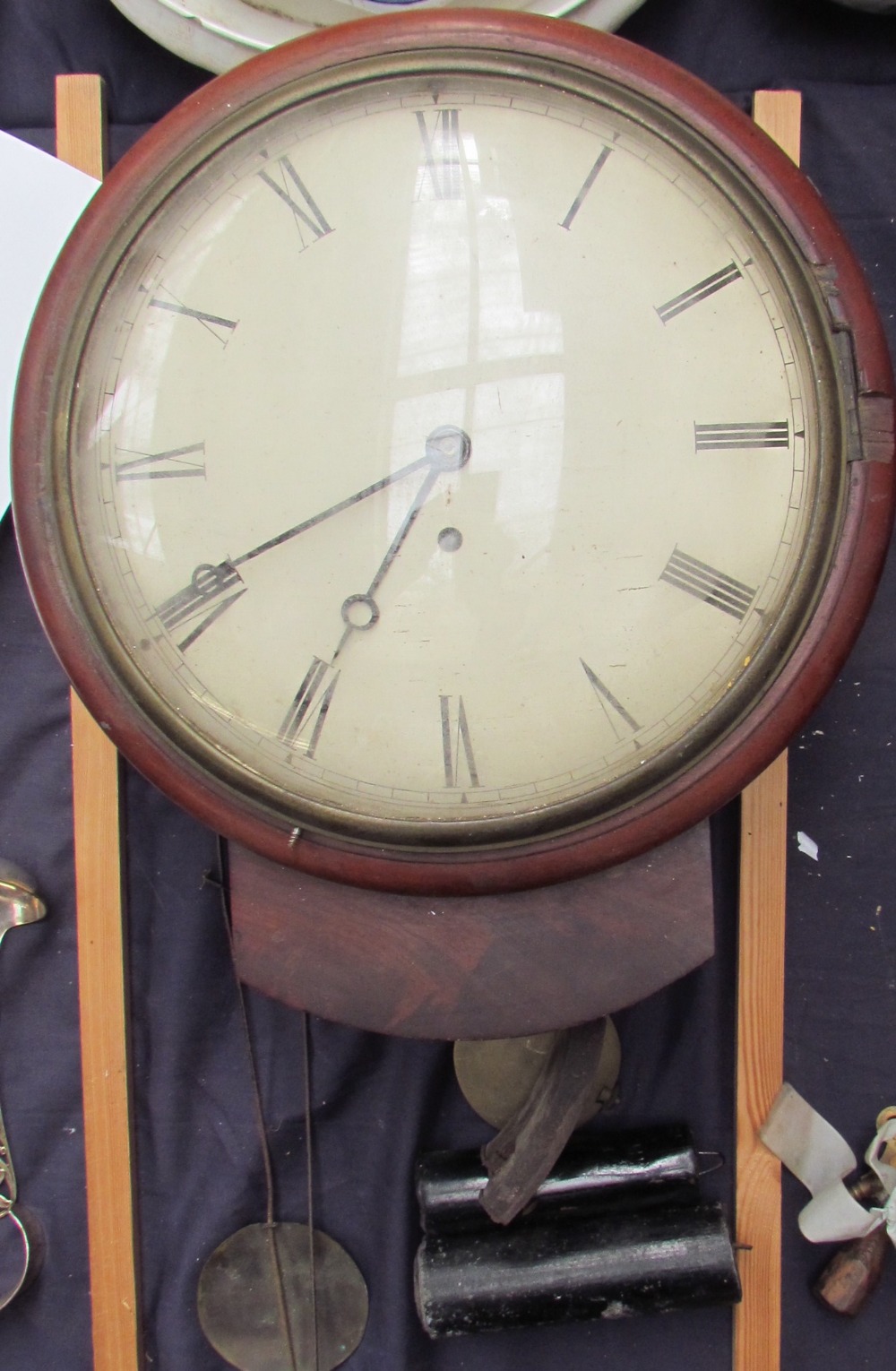 A 19th century mahogany drop dial wall clock, with a circular dial and Roman numerals, 25.