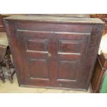 An 18th century oak side cabinet with a pair of panelled doors together with a small oak wall