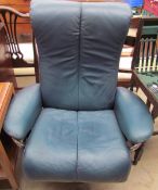 A green leather swivel chair together with a reproduction mahogany Hifi cabinet