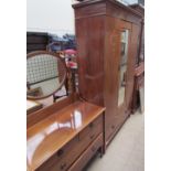 An Edwardian mahogany wardrobe with a mirrored door and a base drawer together with a matching