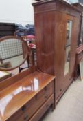An Edwardian mahogany wardrobe with a mirrored door and a base drawer together with a matching