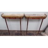 A pair of marble topped and gilt metal mounted pier tables on tapering legs