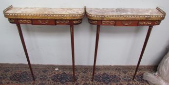 A pair of marble topped and gilt metal mounted pier tables on tapering legs