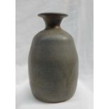 A studio pottery vase, with a mottled blue green ground, impressed with initials and "TUGWMMWD",