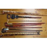 A collection of walking sticks with various ends