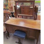 An Edwardian mahogany dressing table together with a Victorian stool with an upholstered top