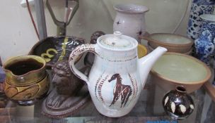 A Sidney Tustin Winchcombe pottery jug, with a mustard yellow glaze,