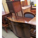 A reproduction mahogany sideboard with a shaped top together with a bedside cabinet