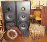 A 20th century walnut mantle clock together with a Chinese pottery vase and a pair of speakers