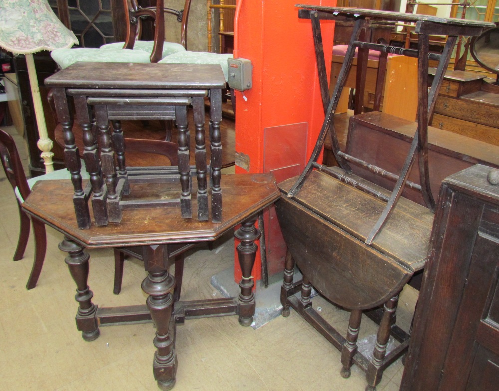 A Victorian pine tea table together with an oak nest of three tables,