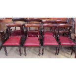 A matched set of eight Regency mahogany dining chairs with a bar back and drop in seats on turned