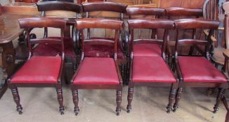 A matched set of eight Regency mahogany dining chairs with a bar back and drop in seats on turned