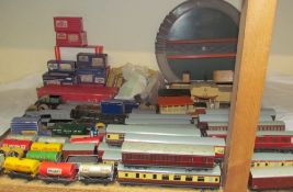 A Hornby Dublo - a quantity of corridor coaches, rolling stock, buildings and a track,