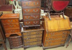 A 20th century yew wood bureau together with three reproduction bedside chests,