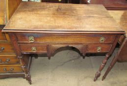 A 19th century oak lowboy with a planked rectangular moulded top above three drawers on turned legs