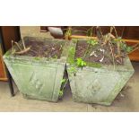 A pair of cast concrete planters