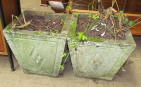 A pair of cast concrete planters