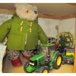 A Paddington Bear teddy together with toy tractors etc