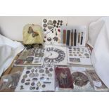 Assorted buttons, slide rules, and badge collections,