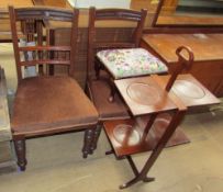 A pair of Edwardian walnut salon chairs together with a foot stool and a folding mahogany cake