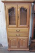 A 20th century oak bookcase with a glazed top,