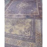 A room size rug with a light green ground together with another rug