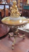 An onyx topped and gilt metal occasional table together with a gilt cherub table lamp