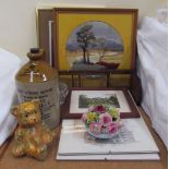 A woolwork together with prints, floral centrepiece, Crown Botanic Brewery stoneware bottle,