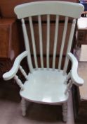 A 19th century green painted slat back kitchen chair