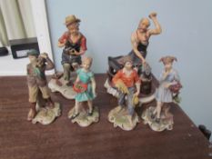 A Capodimonte figure group of a cobbler together with another of a black smith and four other