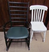 A ladder back rocking chair together with a white painted kitchen chair