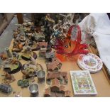 A collection of David Winter cottages, together with Aynsley Master Craft resin animals,