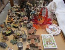 A collection of David Winter cottages, together with Aynsley Master Craft resin animals,