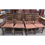 A set of eight 19th century style ladder back dining chairs with rush seats on turned legs