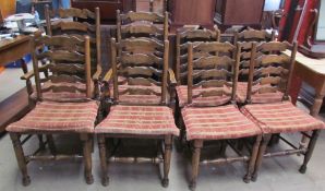A set of eight 19th century style ladder back dining chairs with rush seats on turned legs