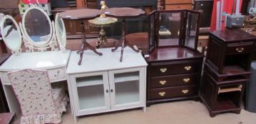 A cream painted dressing table together with a side cabinet with glazed doors, chair,