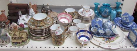 Assorted model cottages together with a continental part coffee set, enamel vases, glass vases,