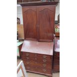 A 19th century mahogany bureau bookcase with a cupboard top,