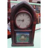 An American mantle clock of pointed arched form with Roman numerals with a printed panel with a