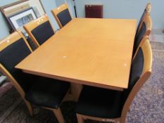 A modern dining table and six chairs