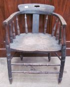 A smoker's bow elbow chair with spindle back and solid seat