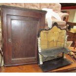 An 18th century oak hanging corner cupboard together with an ebonised wall mirror with floral