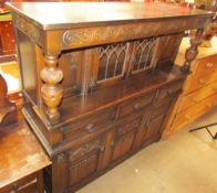 A 20th century oak court cupboard