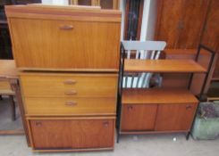 A teak Ladderax wall unit with a drop front,